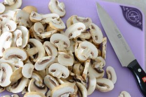 Fresh sliced mushrooms for the best allergy-friendly lasagna